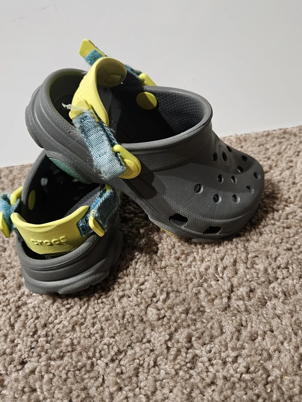CROCS Kids Gray Clogs with Yellow and Blue Accents